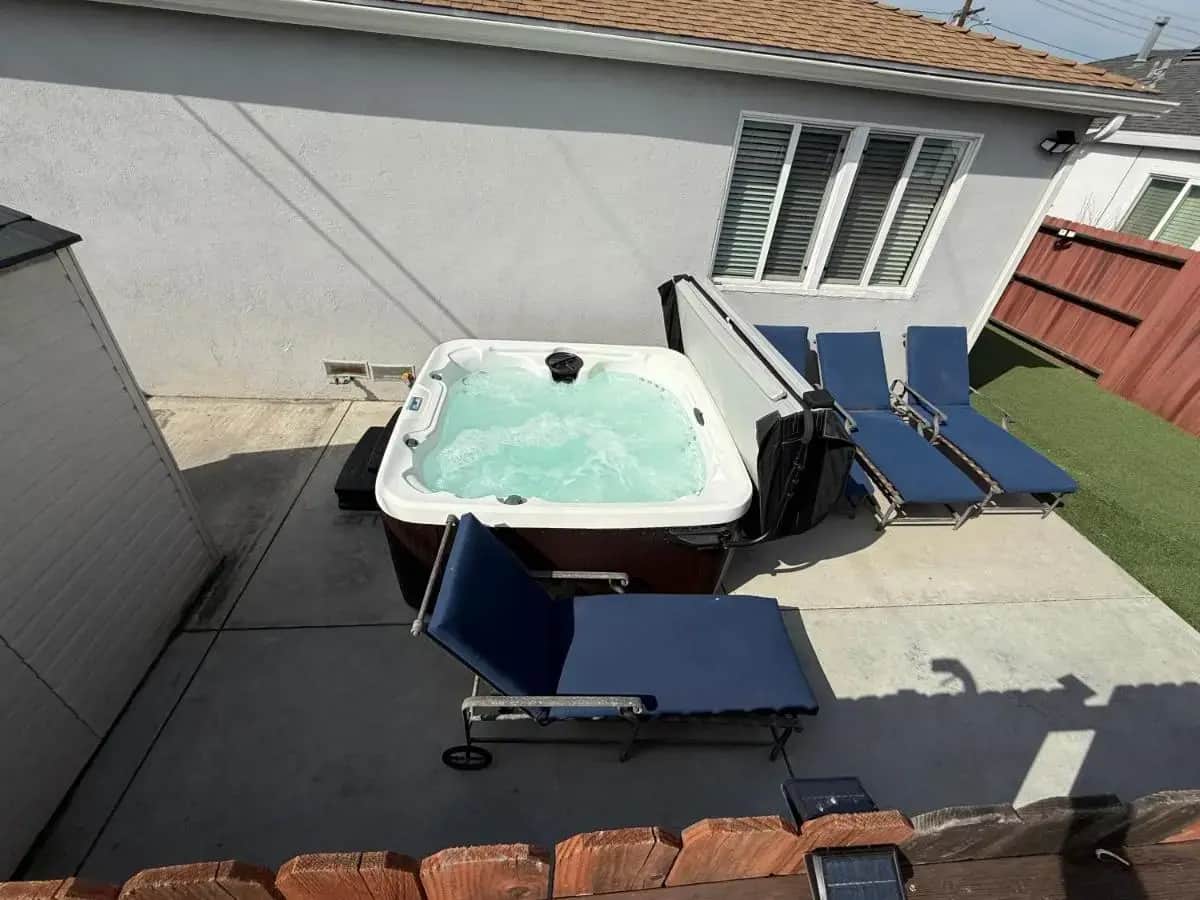 a swimming pool with chairs and a tub in a yard at 3BR Home with Backyard Hot Tub, Parking Near Beaches LAX SoFi Stadium in Lawndale