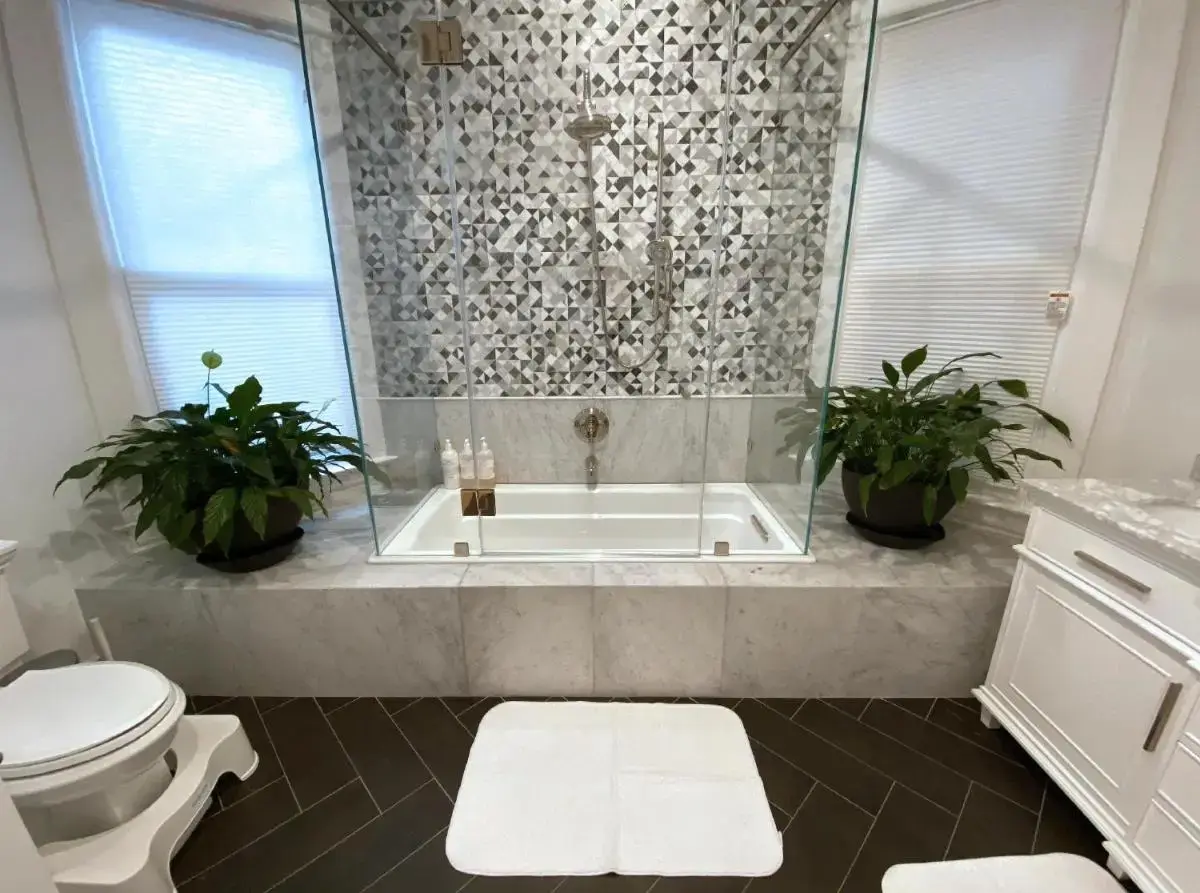 a bathroom with a bath tub and a toilet at 4BR2BA Remodeled Home in the Heart of The Castro! in San Francisco