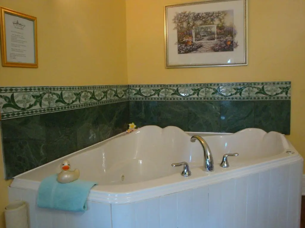 Private in-room jacuzzi tub in the King Suite with Spa Bath at A Moment in Time Bed & Breakfast