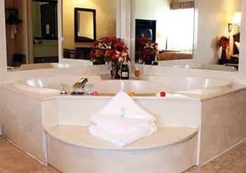 Private in-room jacuzzi tub at A Victory Suites