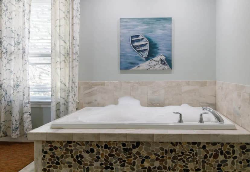Private in-room jacuzzi tub in the King Jetted Tub and Fireplace Compass Rose Building at Admiral’s Inn Resort, Ogunquit