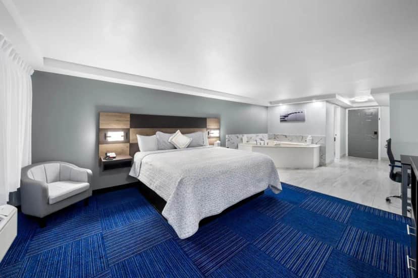Private in-room jacuzzi tub in the Suite King with Spa Bath Smoke Free at Admiralty Inn & Suites - A Red Collection Hotel