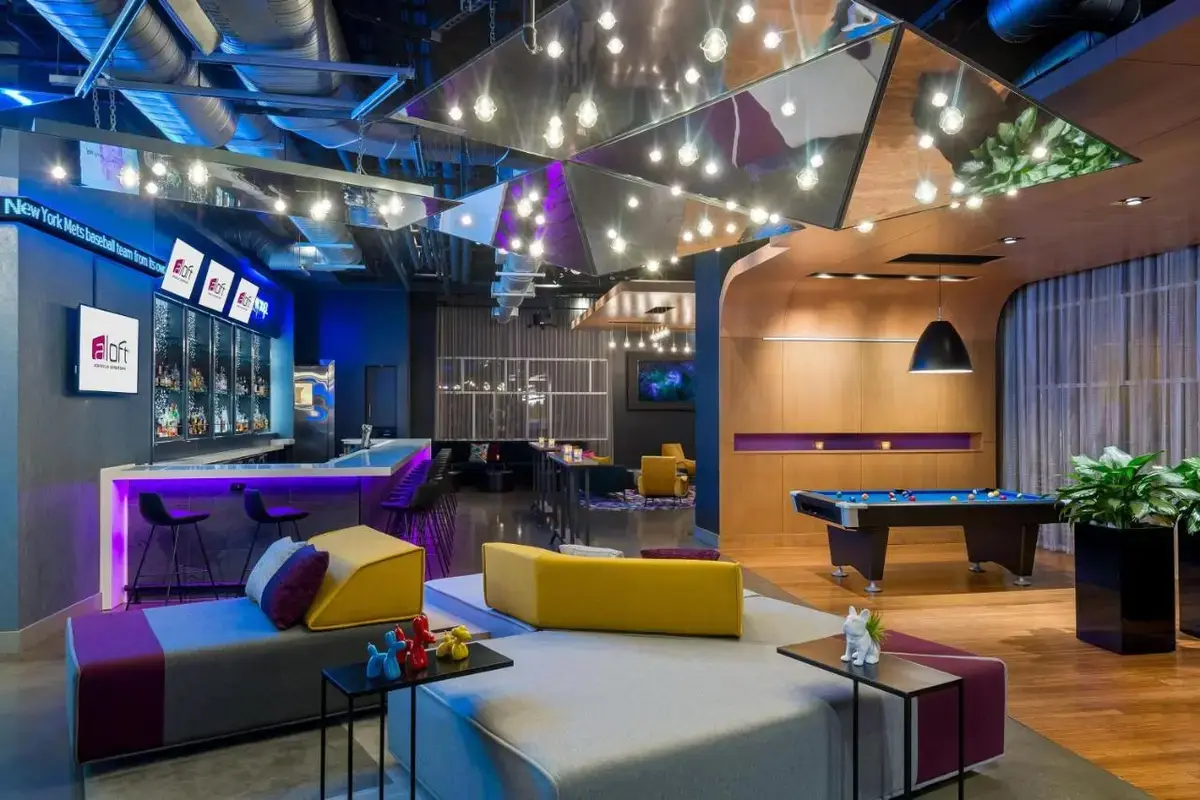a lobby with couches and a pool table at Aloft by Marriott Asheville Downtown in Asheville