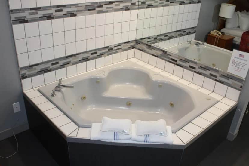 Private in-room jacuzzi tub at American Inn & Suites Ionia