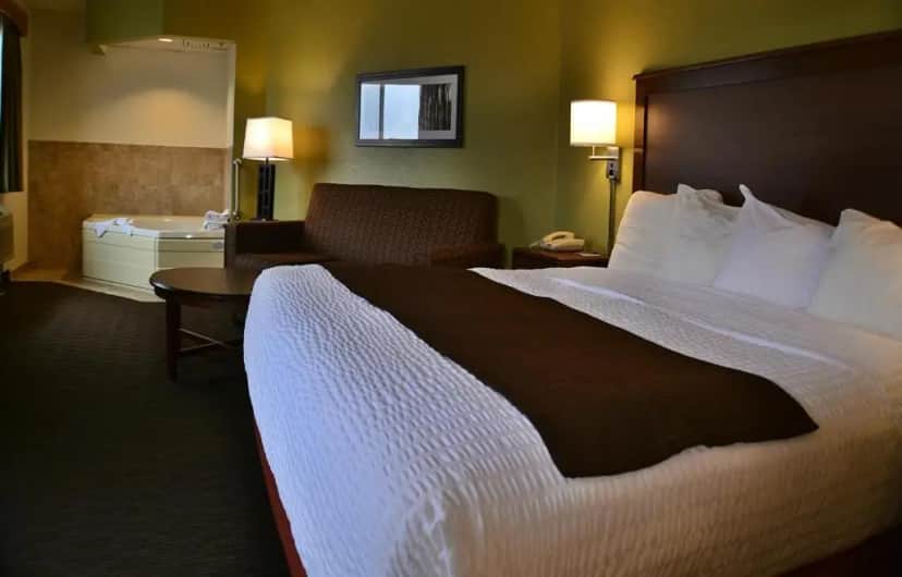 Private in-room jacuzzi in the Deluxe Corner King Studio Suite - Non-Smoking at AmericInn by Wyndham Calumet