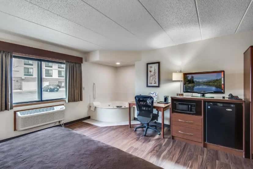 In-room jacuzzi tub at AmericInn by Wyndham Coon Rapids in Coon Rapids, MN