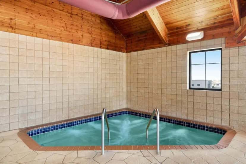 In-room hot tub at AmericInn by Wyndham Laramie Near University of Wyoming in Laramie, WY
