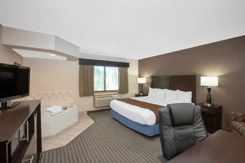 Private in-room jacuzzi tub at AmericInn by Wyndham Lincoln North