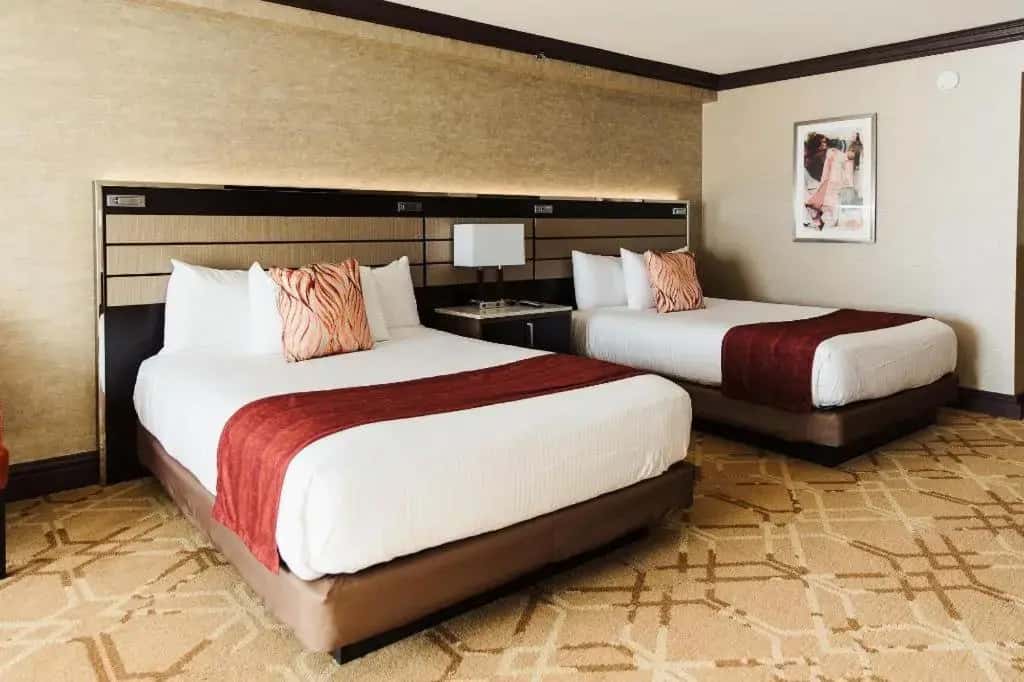 a hotel room with two beds in a room at Ameristar Casino Hotel Kansas City in Randolph