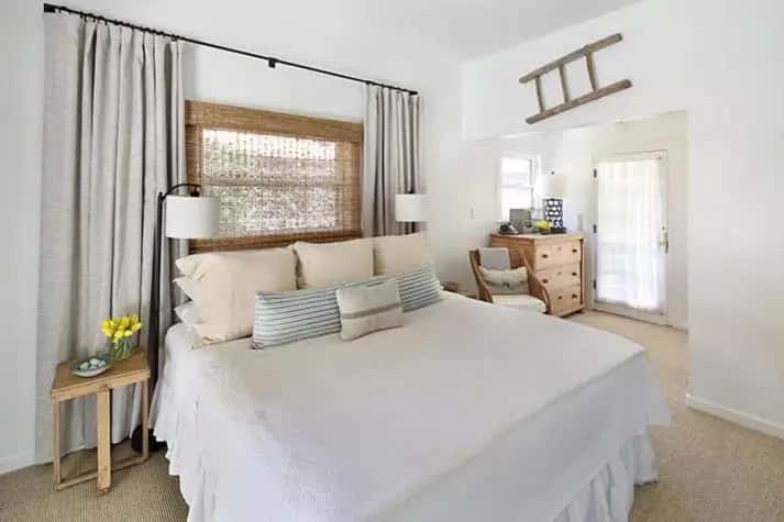 a white bedroom with a large white bed with pillows at An Inn to Remember in Sonoma
