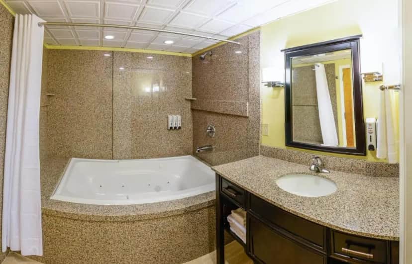 Private in-room jacuzzi tub in the Suite with Hot Tub at Asbury Inn & Suites
