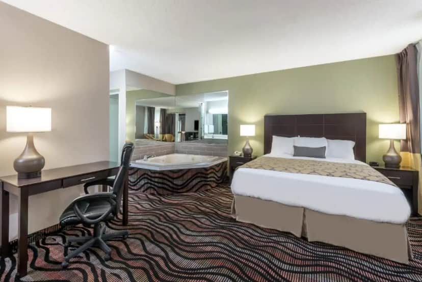 Private in-room jacuzzi in the Deluxe King Suite at Baymont By Wyndham Cambridge