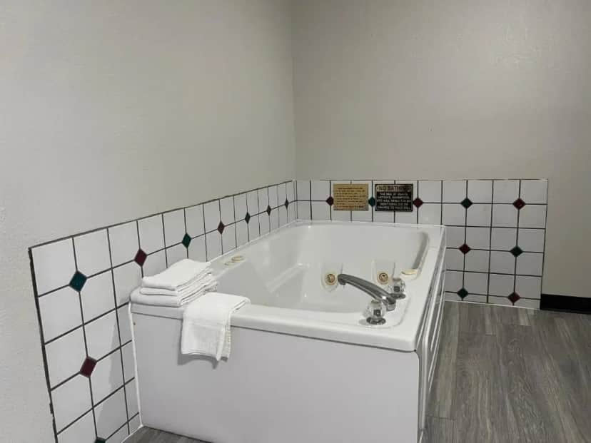 Private in-room jacuzzi tub in the Deluxe King Suite - Non-Smoking at Baymont by Wyndham Omaha SW