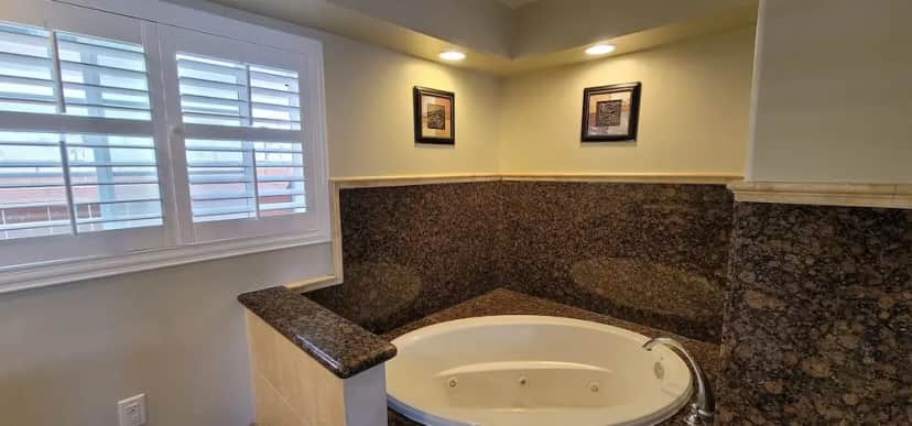Private in-room jacuzzi tub in the Junior Suite, 1 King Bed, Hot Tub at Beachwalker Inn & Suites