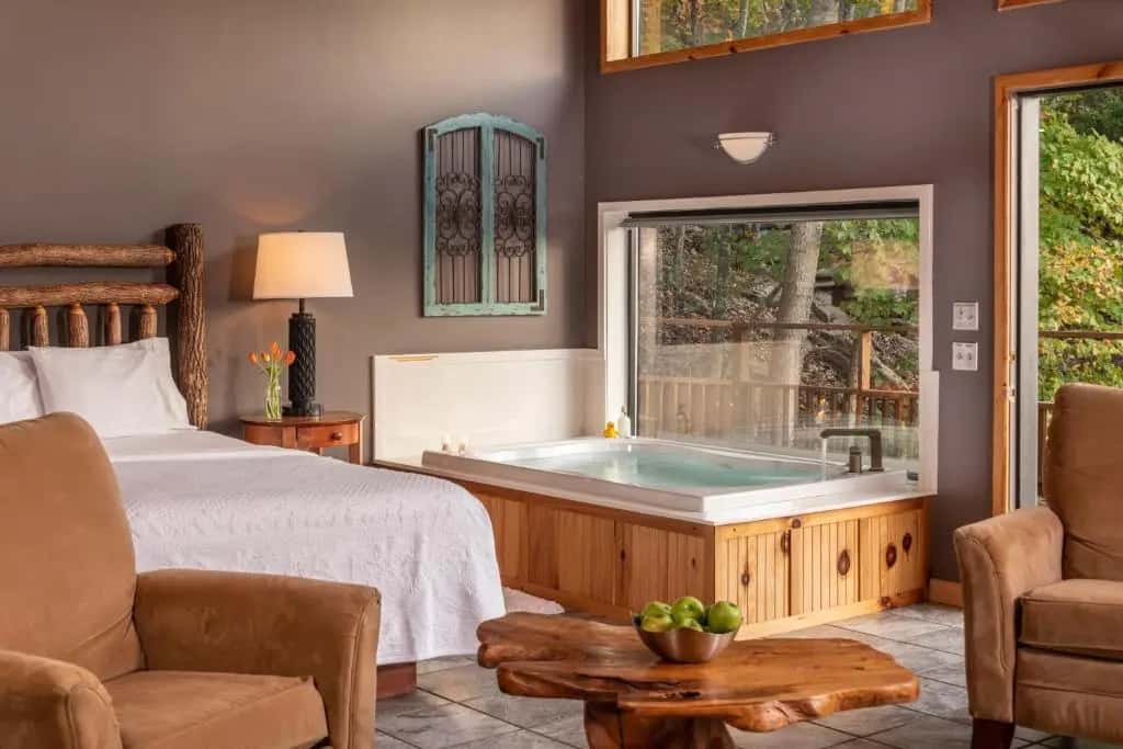 Private in-room jacuzzi in the Premier King Cabin with Lake View at Beaver Lakefront Cabins – Couples Only Getaways