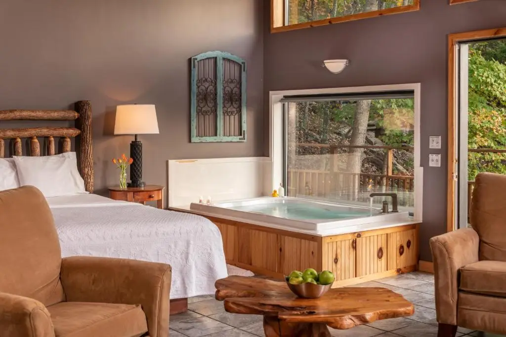 Private in-room jacuzzi in the Premier King Cabin with Lake View at Beaver Lakefront Cabins – Couples Only Getaways