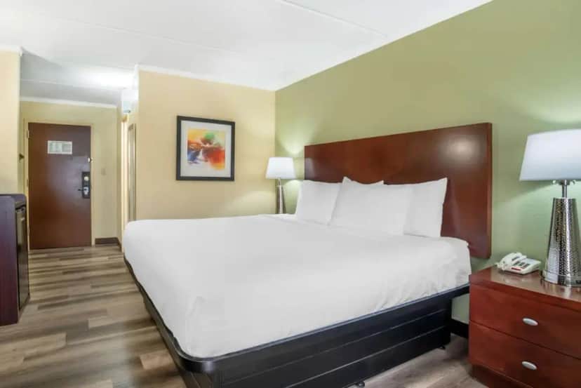 a hotel room with a large bed and a telephone at Best Western Charlotte-Gastonia in Gastonia