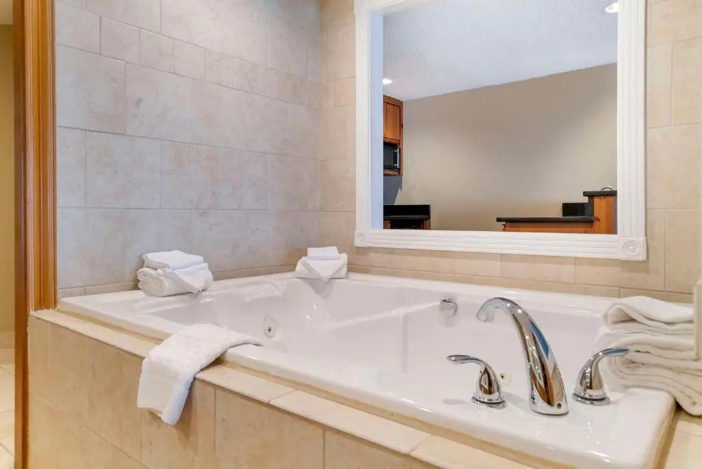 Private in-room jacuzzi tub in the Queen Suite with Two Queen Beds, Fireplace and Spa Bath - Non-Smoking at Best Western Greenfield Inn