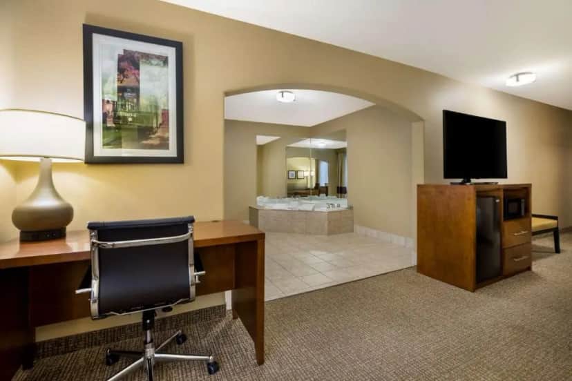 Private in-room jacuzzi in the King Suite with Roll-In Shower, Sofa Bed and Spa Bath - Disability/Non-Smoking