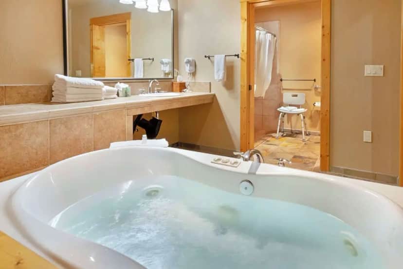 Private in-room jacuzzi tub in the Suite, 1 King Bed with Sofa bed, Accessible, Non Smoking (with Sofabed) at Best Western Ponderosa Lodge
