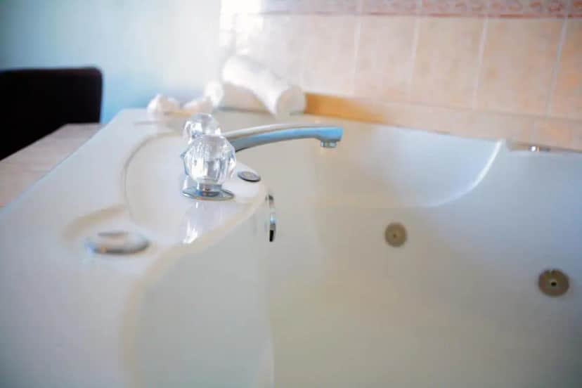 a bathroom with a sink and a bath tub at Bolero Resort in Wildwood