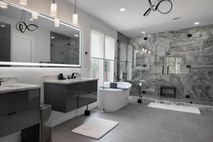 a bathroom with two sinks and a tub and a shower at Breathless Modern Compound in Decatur