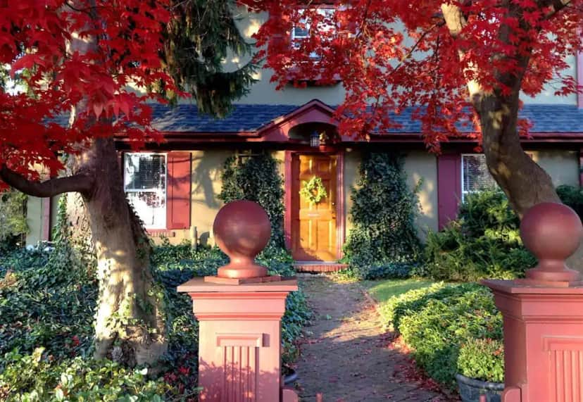 a house with a tree in front of it at The Lancaster Bed and Breakfast in Lancaster
