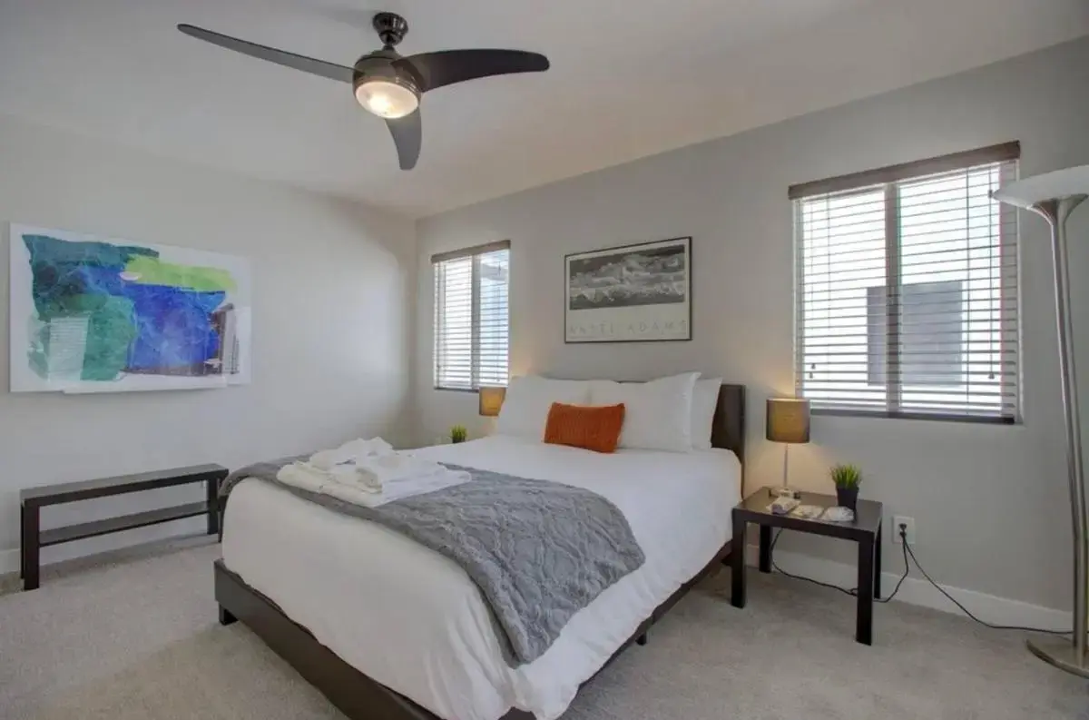 a bedroom with a bed and a ceiling fan at Casa Solara Pool*Hot Tub*Wi-Fi in Scottsdale