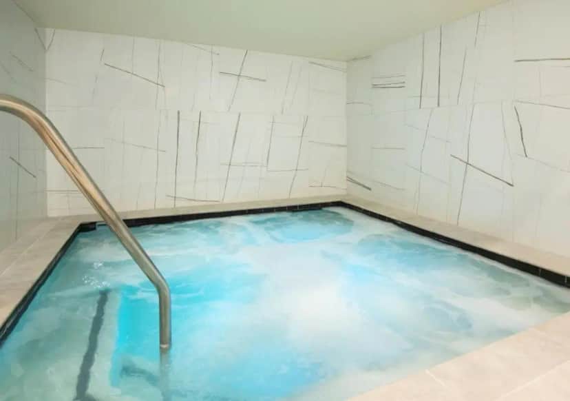 a hot tub with blue water in a room at Cheyenne Mountain Resort, a Destination by Hyatt Hotels in Colorado Springs
