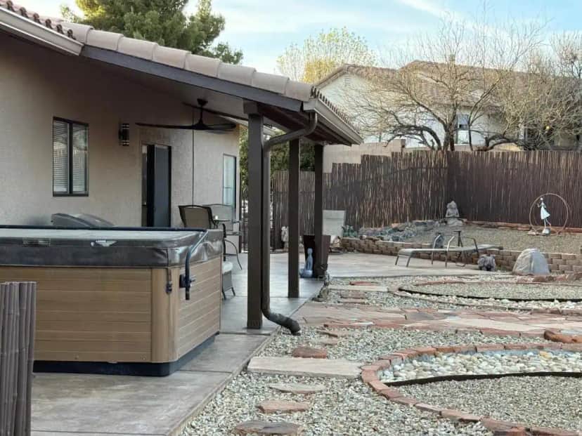 a backyard with a hot tub and a patio at Clarkdale Serenity in Clarkdale