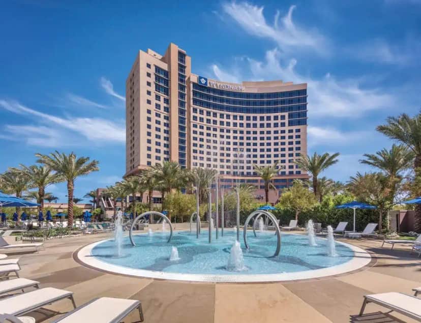a hotel with a fountain in front of a building at Club Wyndham Desert Blue in Las Vegas