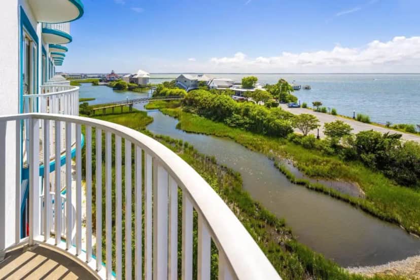 a view of a river from a balcony at Coconut Malorie Resort Ocean City, an Ascend Collection Hotel in Ocean City