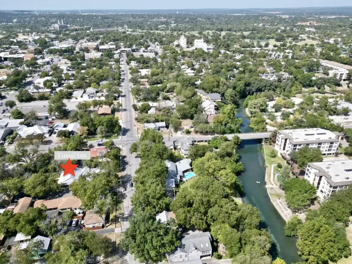 an aerial view of a city with a river at Comal Inn in New Braunfels