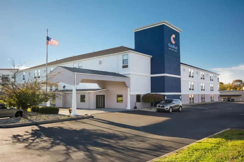 a hotel with a car parked in front of it at Comfort Inn & Suites Cincinnati Eastgate in Eastgate