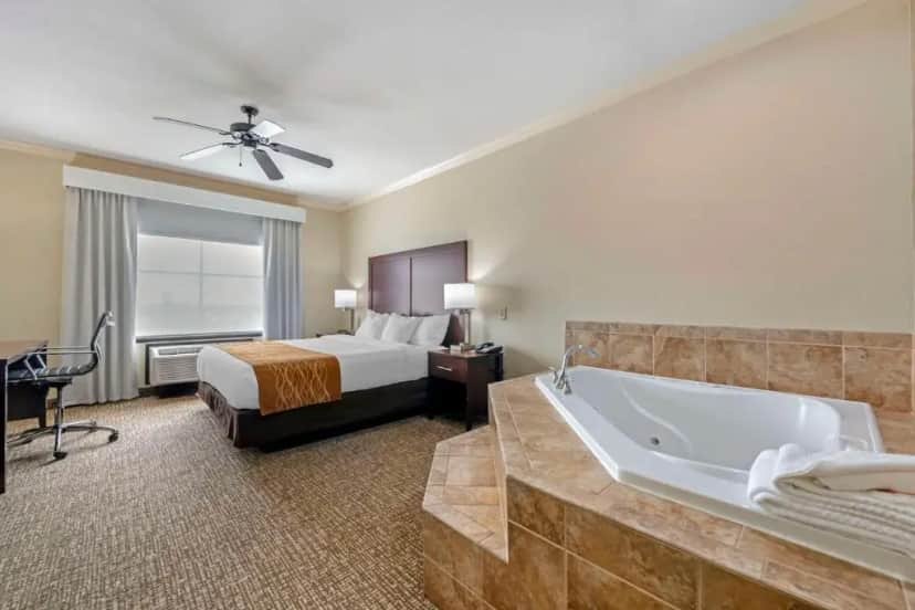 Private in-room jacuzzi tub in the King Room with Spa Bath at Comfort Suites at Lake Worth