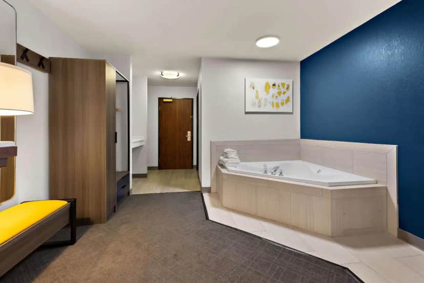 Private in-room jacuzzi in the One-Bedroom King Suite with Spa Bath at Comfort Inn & Suites