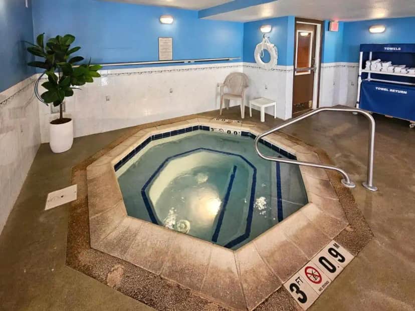 a jacuzzi tub in the middle of a room at Comfort Inn & Suites Geneva- West Chicago in Geneva