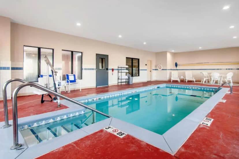 a large swimming pool in a building at Comfort Inn & Suites Norman near University in Norman