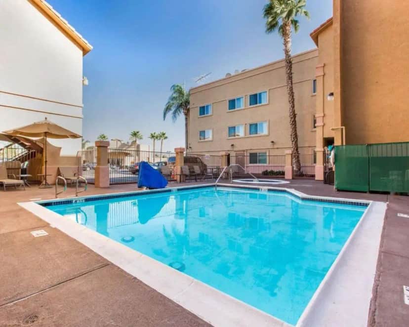 a large swimming pool in front of a building at Comfort Inn & Suites Moreno Valley near March Air Reserve Base in Moreno Valley