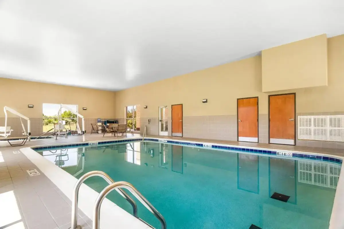 a large swimming pool in a hotel room at Comfort Suites in Mount Vernon