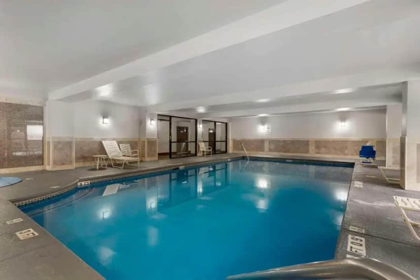 a large swimming pool in a hotel room at Comfort Suites Atlanta Airport in Forest Park