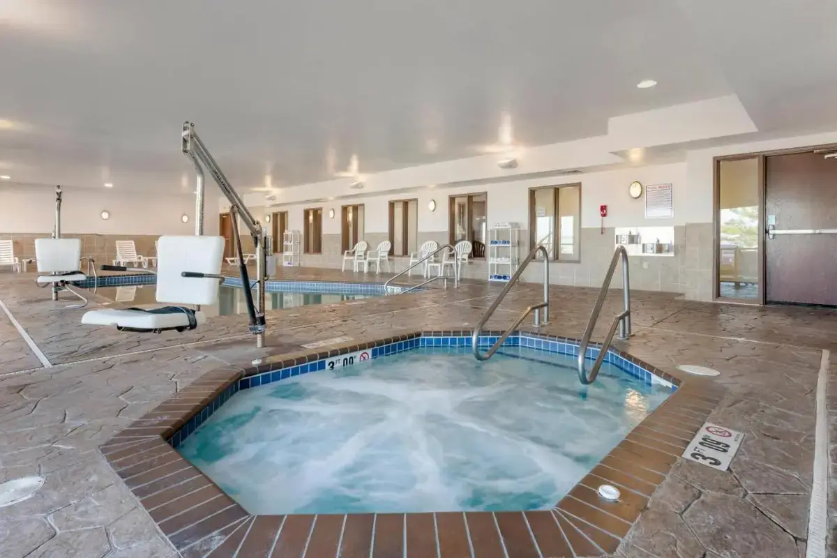 a hot tub in the middle of a hotel room at Comfort Suites Conference Center Rapid City in Rapid City