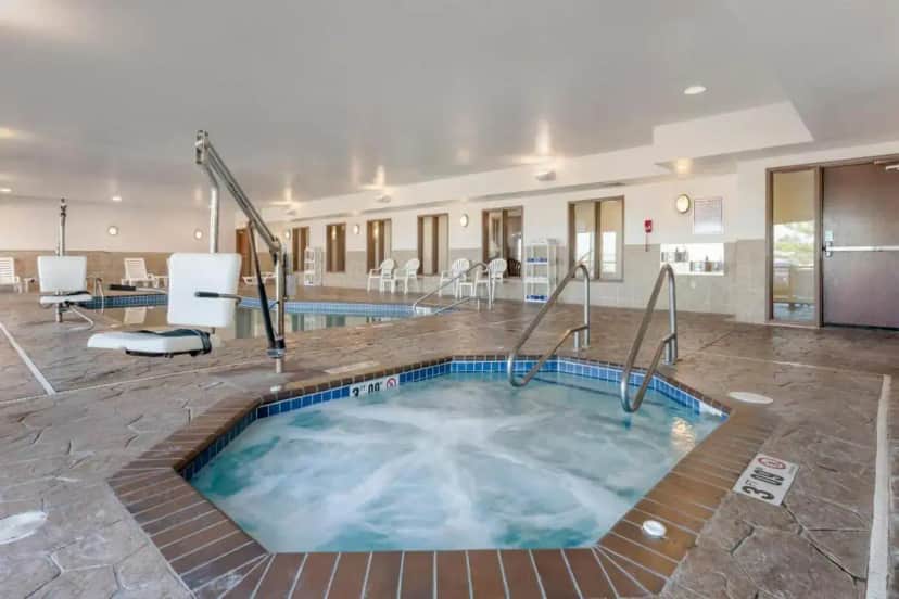 a hot tub in the middle of a hotel room at Comfort Suites Conference Center Rapid City in Rapid City
