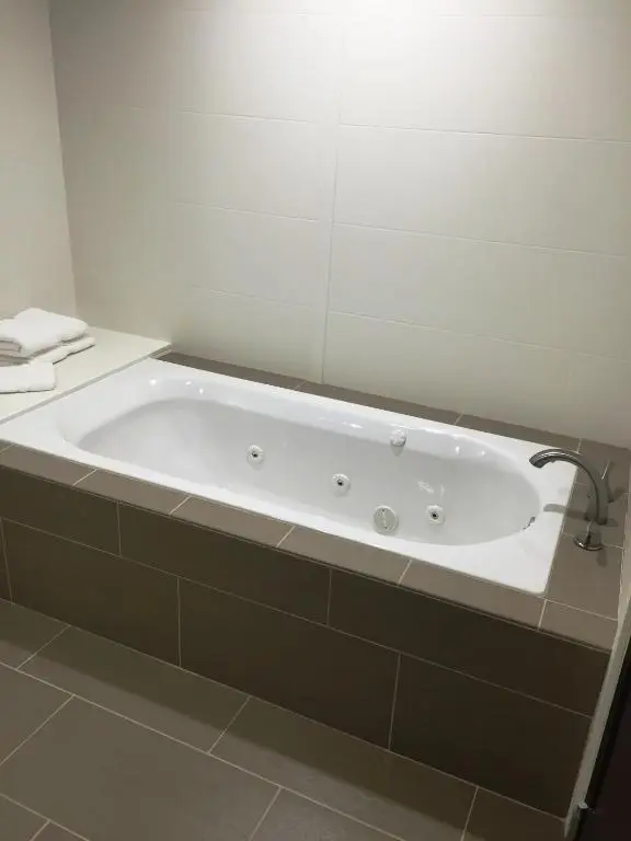 Private in-room jacuzzi tub in the King Suite with Whirlpool - Non-Smoking at Comfort Suites