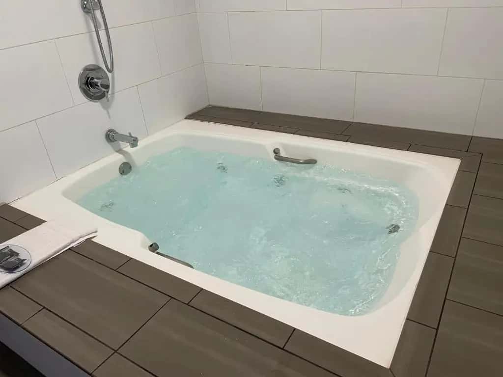 Private in-room jacuzzi tub in the Whirlpool Suite with Two Queen Beds - Non-Smoking at Country Inn & Suites by Radisson, Bakersfield, CA