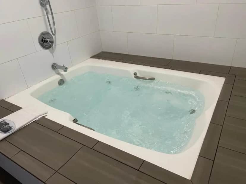 Private in-room jacuzzi tub in the Whirlpool Suite with Two Queen Beds - Non-Smoking at Country Inn & Suites by Radisson, Bakersfield, CA