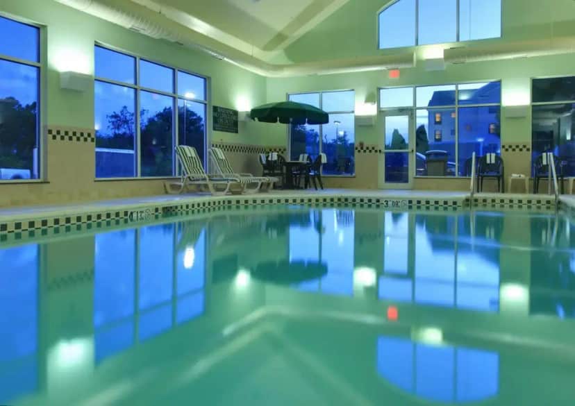 a swimming pool in a building at Country Inn & Suites by Radisson, Bentonville South - Rogers, AR in Rogers
