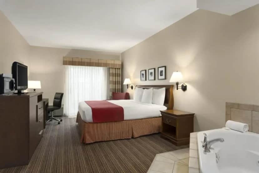 Private in-room jacuzzi tub in the King Suite with Whirlpool - Non-Smoking at Country Inn & Suites by Radisson, Cedar Rapids Airport, IA