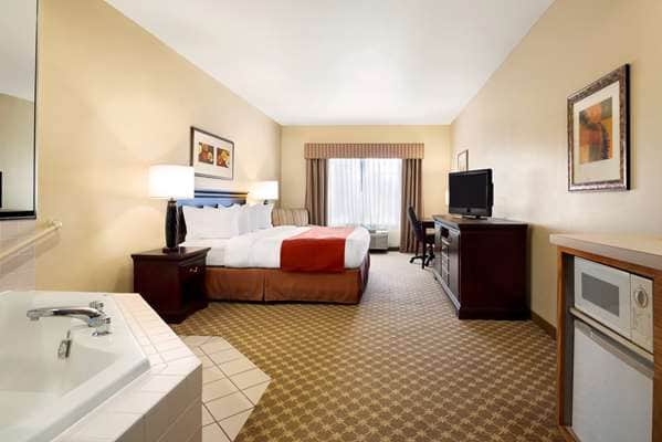 Private in-room jacuzzi tub at Country Inn & Suites by Radisson, Clinton, IA