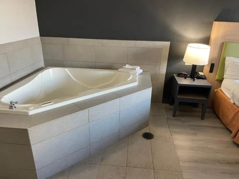Private in-room jacuzzi tub in the King Suite with Whirlpool - Non smoking at Country Inn & Suites by Radisson, College Station, TX